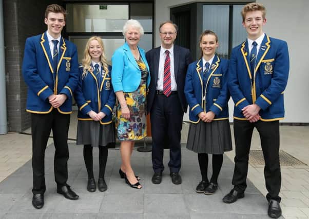 Dame Mary Peters and Education Minister Peter Weir with pupils at the opening of Belfast High School's new sports and drama facilities. INNT 22-521CON Pic by Kelvin Boyes
