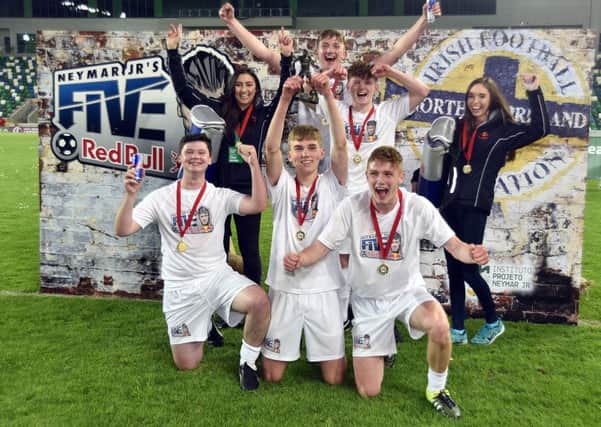 Red Bull Wings Team Alice and Zoe at the National Stadium at Windsor Park with Distillery Elite, regional winners Daniel Larmour, Brian Trohear, Darius Roohi and Thomas Macklin who all play for Lisburn Distillery along with Chris Elliott who plays for Tullycarnet.