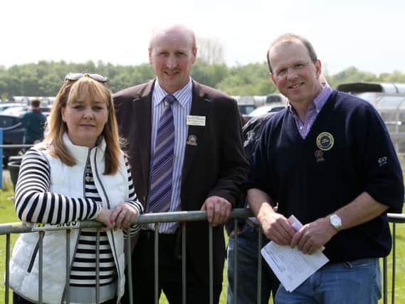 New Minister of Agriculture Michelle McIlveen, who attended Ballymena Show on Saturday is seen here with show chairman Mr Robert Dick and Coloured Breeds Chief Stewart Willie Johnston. INBT 22-123JC