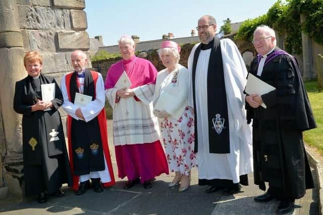 The Lord Lieutenant for County Antrim Joan Christie OBE with members of the clergy at St Nicholas' Church, Carrickfergus. INCT 22-780-CON