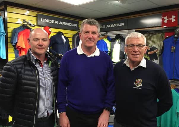 Mark Currie (centre) celebrates success in the Professional's Prize and PGA Tankard at Carrickblacker with, from left, Paul Stevenson (club professional) and Stanley Jelly (club captain).