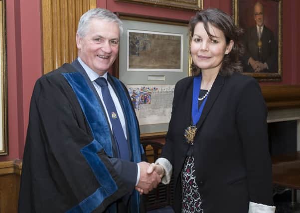 Mr Jim Dobson OBE is pictured with the Worshipful Company of Butchers Master Patricia Dart.