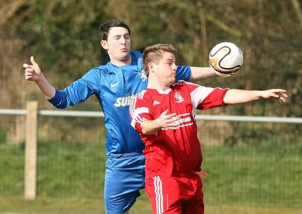 Ronnie Burns (right) in action for Ballynure Old Boys.