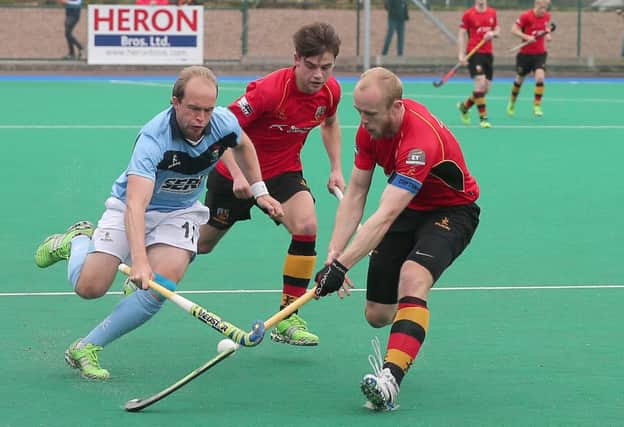 Lisnagarvey's Timothy Cockram and Banbridge's Kyle Marshall and Eugene Magee in EY Champions Trophy Final hosted by Banbridge Hockey Club. Photograph By Declan Roughan