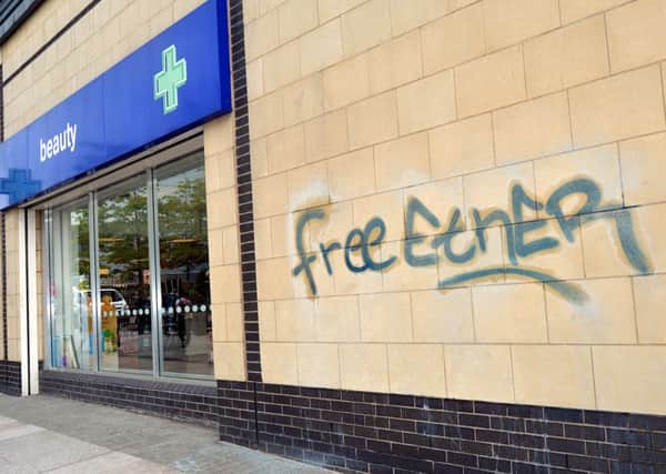 Graffiti which appeared on Boots and other Town Centre business premesis over the weekend. INPT23-268.