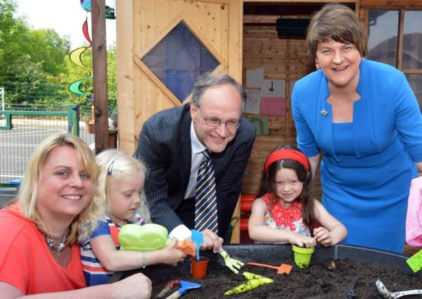 First Minister, Arlene Foster and Education Minister, Peter Weir pictured getting their hands dirty with P1 pupils of Birches Primary School and their teacher Claire Morrow. Pupils included are from left, Faith Hall, Karis Armstrong and Hayley Dunlop. INPT23-263.