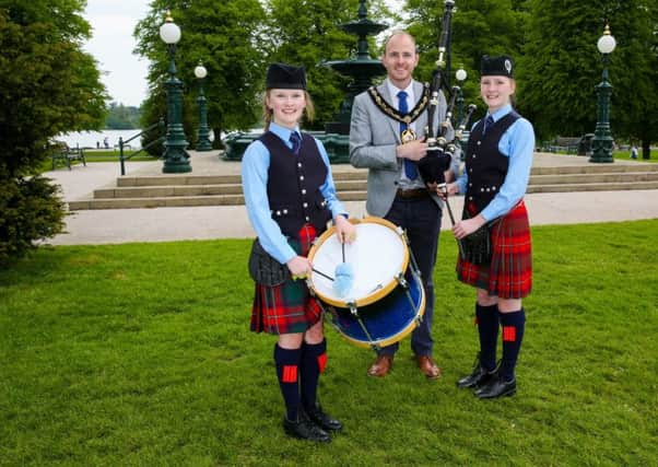 The Craigavon and Districts Pipe Band Championship will take place in Lurgan Park on Saturday, June 18th. There will also be a 'Stroll in the Park' in aid of the Children's Hospice on Friday, June 17th, at 7.30pm.
Pictured at the launch of the event is Ma