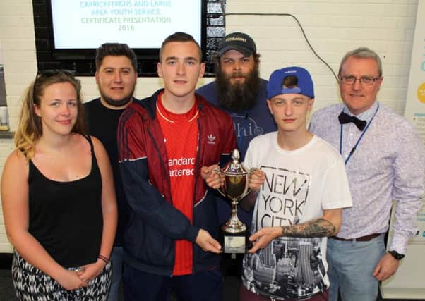 David McNeilly and Karl Acton accept the 2016 Danny Nolan Memorial Trophy on behalf of Ballyduff Club CC who developed and delivered a youth work programme for younger children in the area. Also pictured are Charlotte Clarke, Assistant Youth Support Worker, David McEvoy, Youth Support Worker-in-Charge, Alwyn Honan, Senior Youth Worker and Frances Loughlin, Acting Area Youth Officer for Newtownabbey, Carrick and Larne. INLT-23-701-con