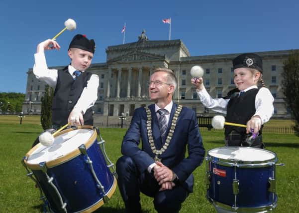 Lord Mayor, Alderman Brian Kingston is joined by two young competitors Oliver and Evie who will be taking part in the UK Pipe Band Championships.