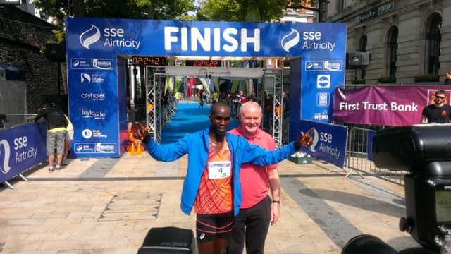 Kenyan runner, Eric Koegh pictured with Deputy First Minister, Martin McGuinness after winning the Walled City Marathon.
