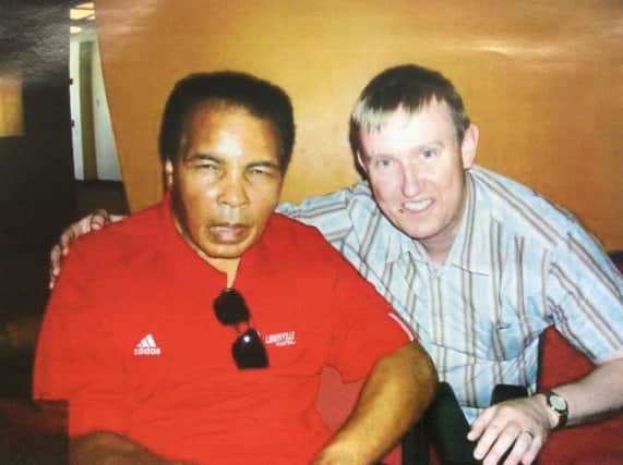 North Antrim DUP MLA Mervyn Storey pictured with Muhammad Ali. inbm24-16s