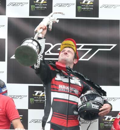 PACEMAKER, BELFAST, 4/6/2016:  Michael Dunlop  (Hawk Racing) celebrates his win on the podium of the Superbike TT race on the Isle of Man today.
PICTURE BY STEPHEN DAVISON