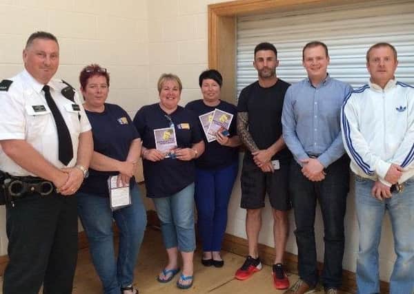 The 'Pizza With Peelers' event at Greenland Community Centre. Pictured with an officer from Larne Neighbourhood Policing Team are PAL representatives Mary Todd, Annette White and Beverly Sharples, Gareth McConnell of Factory Community Forum (FCF), East Antrim MLA Gordon Lyons, and Norman Thompson of FCF. INLT 23-671-CON