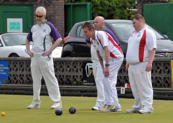 Larne Bowling Club's Andy Kyle and Darren Witherspoon watch their colleague's bowl arrive in the head. INLT 23-202-AM