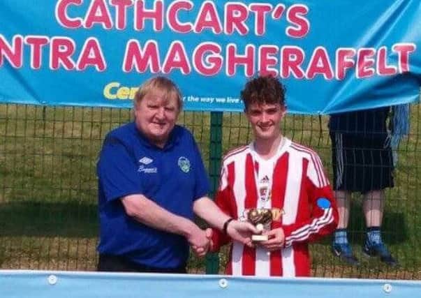 Carniny Youth U14 Player Jake White receives the Player of the Tournament award at the Magherafelt Sky Blues Youth Tournament.
