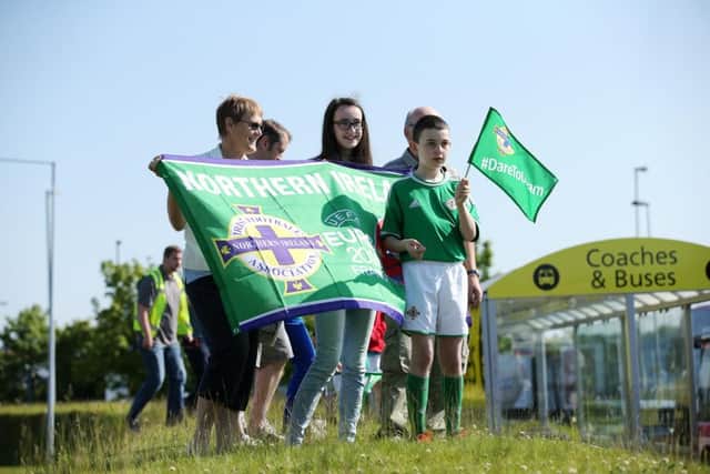Fans watch the Northern Ireland football squad as they leave for the 2016 Euros.  Picture by Kelvin Boyes / Press Eye