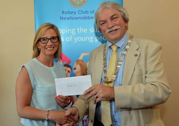 Roz McFeeters, Principal of Hill Croft School, with Leonard Sproule, President of the Rotary Club of Newtownabbey. INNT 23-010-PSB