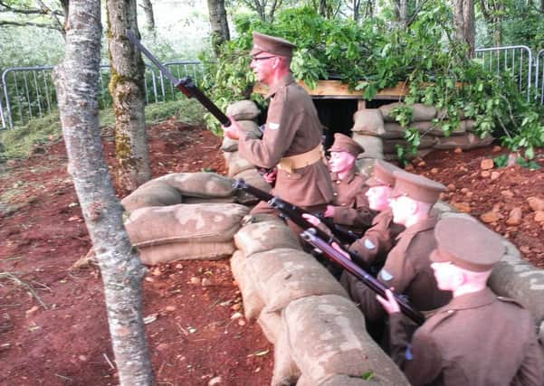 Trench warfare: Re-enactors in the mock trenches representing Ulster Division positions on the Somme front which have been built by the Broughshane and District Somme Commemoration Committee at the Buttermilk Bridge in the village.