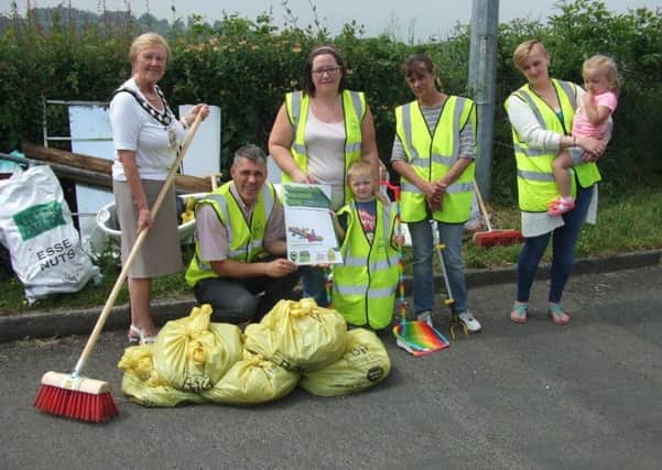 Craigywarren residents Joshua Dowds, Martha Ann Bunnes and Brooke McCally were joined by Mayor Councillor Audrey Wales MBE and the Councils Environmental Health Officer, Kevin Woodin, to lend a helping hand in scrubbing up the Craigywarren Estate as part of a series of Summer Sweep Up events organised by Mid & East Antrim Borough Council to help improve local areas.(Submitted)