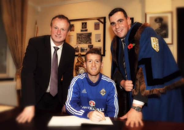 Alderman Stewart McDonald with Northern Ireland manager Michael O'Neill and skipper Steven Davis at a civic function in Ballymena earlier this year.
