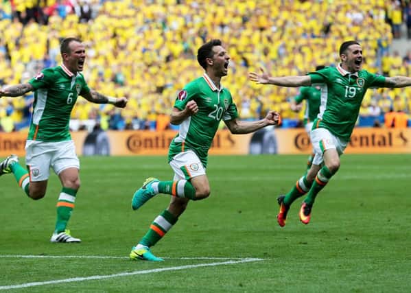 Republic of 
Ireland's Wes Hoolahan celebrates scoring against Sweden with Glenn Whelan and Robbie Brady