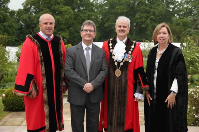 Congratulating Sir Jeffrey Donaldson, MP on his recent Knighthood in the Queens 90th Birthday Honours for his services to politics are (l-r) Chairman of Lisburn & Castlereagh City Council's Corporate Services Committee, Alderman James Tinsley, the Mayor, Councillor Thomas Beckett and Chief Executive, Dr Theresa Donaldson.