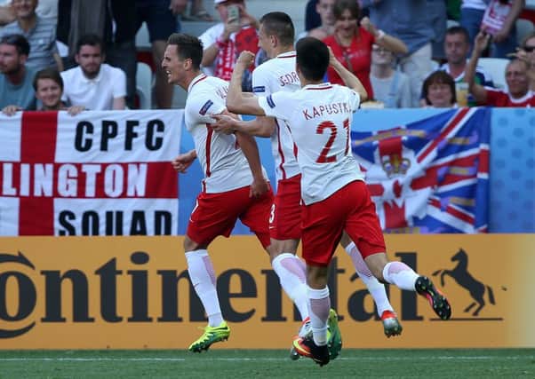 Poland's Arkadiusz Milik celebrates after scoring  against Northern Ireland