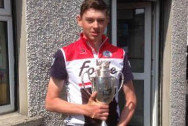 Claudy cyclist Ryan Reilly with the Red Hand trophy he won in May.