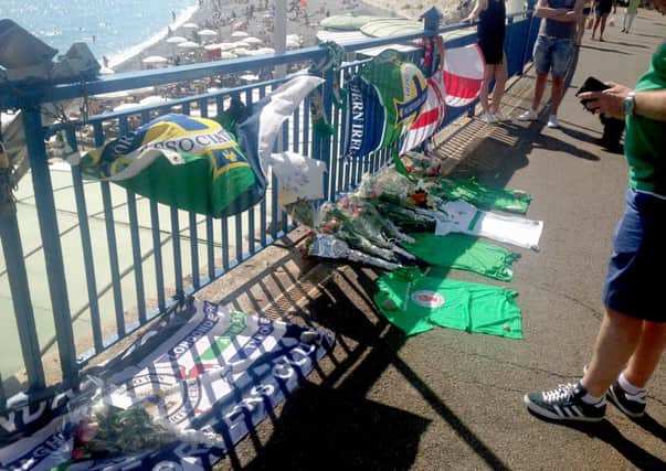 Tributes are placed by Northern Ireland fans in memory of Darren Rodgers, who died in Nice.