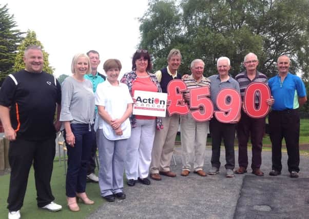 The Tea and Toast society at Silverwood Golf Club raised Â£590 for Action Cancer. The cheque was presented by Catherine from ABC council.