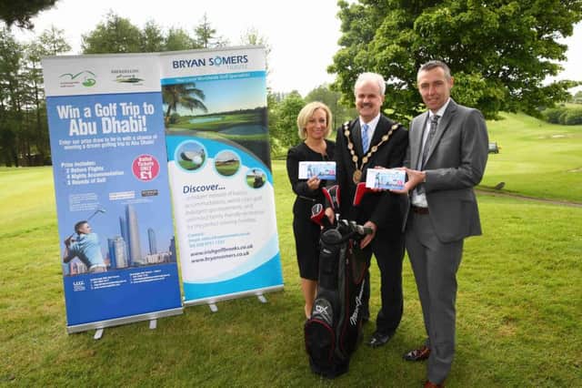 The Mayor of Lisburn & Castlereagh City Council Thomas Beckett launches the sale of the ballot tickets for the Abu Dhabi prize draw with sponsors Bryan Somers Travel and Etihad Airways.