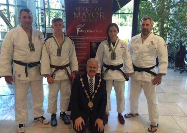 The Simply Judo Medallists (except Daniel who has retuned to Oxford University to sit exams) with the Mayor of Lisburn & Castlereagh City Council, Councillor Thomas Beckett.
