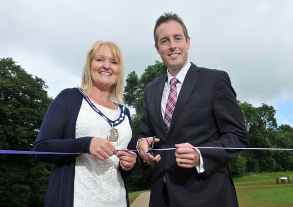 Minister for Communities Paul Givan MLA and the Deputy Chair of Mid Ulster District Council, Councillor Sharon McAleer cut the ribbon to officially open Tullaghoge Fort following the completion of significant works as part of a Â£500K investment.