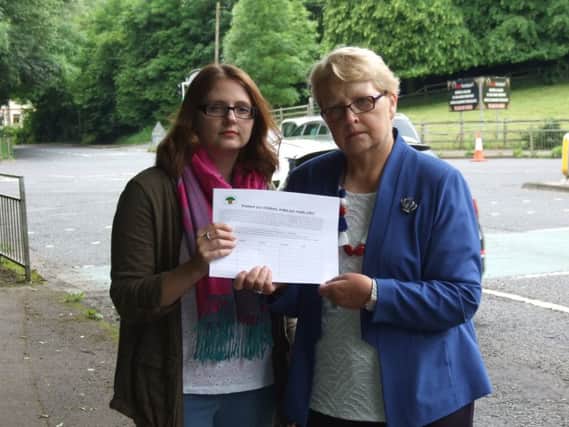 Emma Hassard, who started the petition, with Councillor Margaret Tolerton at the junction of McKinstry Road and The Cutts