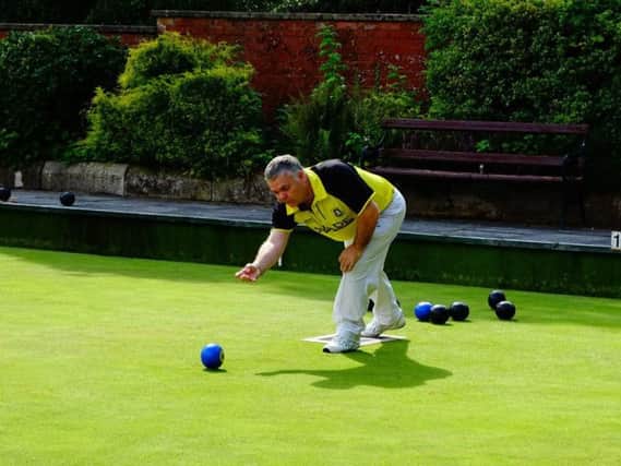 A Dunbarton bowler in action as their cup campaign continues.