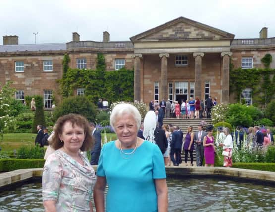 Ballymena Festival executive committee members Mairead Richards and Dorothy Collie who were guests at the annual Hillsborough Garden Party hosted by Secretary of State for Northern Ireland Theresa Villiers.