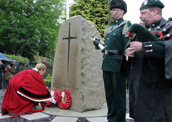 The Mayor of Mid & East Antrim Borough, Audrey Wales MBE lays a wreath at the new war memorial in Kells & Connor which was dedicated at a ceremony on Sunday.