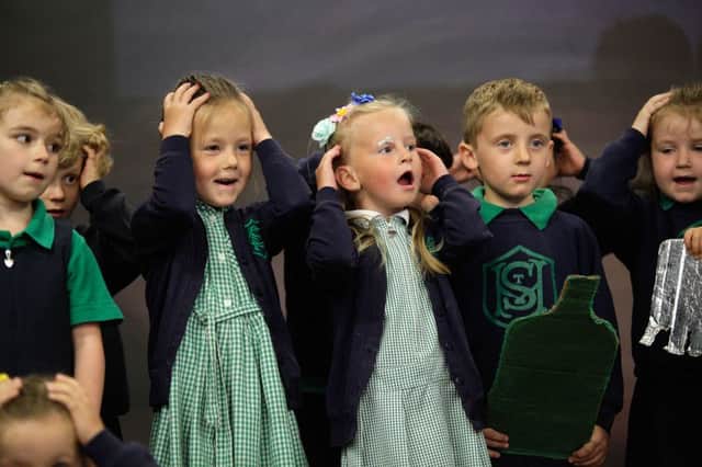 St Malachy's Primary School pupils on stage during a retirement celebration day last week. INCR24-316PL