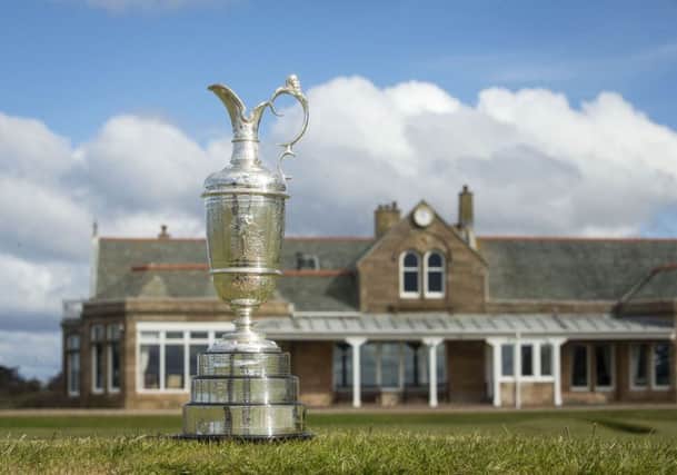 The Claret Jug sits with the clubhouse behind during the photocall at Royal Troon Golf Club, South Ayrshire. Photo credit: Danny Lawson/PA Wire.