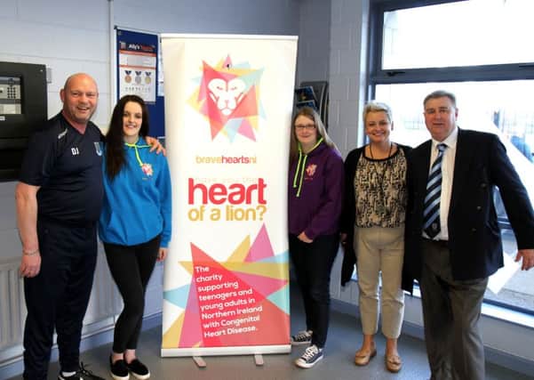 Shealynn and Clare Caulfield and Emma McCartney of Bravehearts NI who are organising a fund-raising football tournament on July 30. Also included are David Jeffrey and Brian Thompson, of Ballymena United, who are supporting the event. Picture: Reid McAuley.