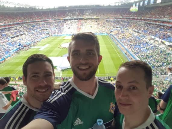 Local NI fans Mark Potts (left), Jonny and Geoffrey Kerr (right) all smiles at the Stade des LumiÃ¨res.