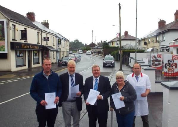 Councillor Jonathan Craig (centre) at Low Road with representatives of Hilden Community Association and local traders who have raised a petition calling for a new pedestrian crossing in the area.
