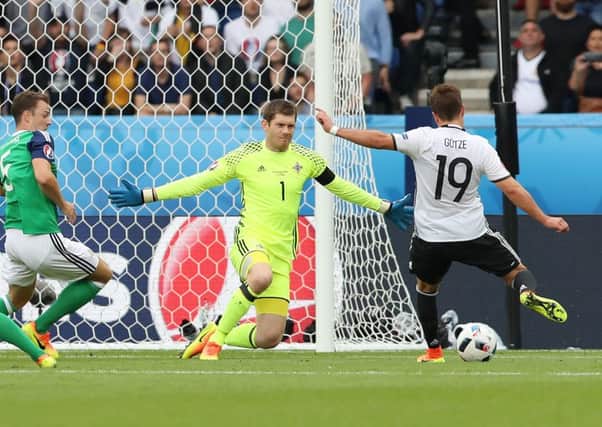 Northern Ireland's Michael McGovern saves from Germany's Mario Gotze.