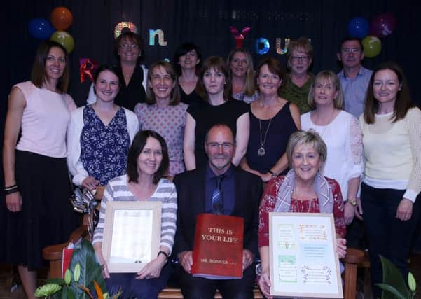 Mr Charlie Bonner who is retiring after 27 years loyal service at  Glenravel Primary School was the subject of a "This Is Your Life" show in the parish centre last week when he arrived for what he thought was the school's end of year concert. Charlie is seen here with the school staff including Claire McAleenan (front right) who is retiring after 25 years at the school and Jean O'Loan (front left) who has been there for 12 years.