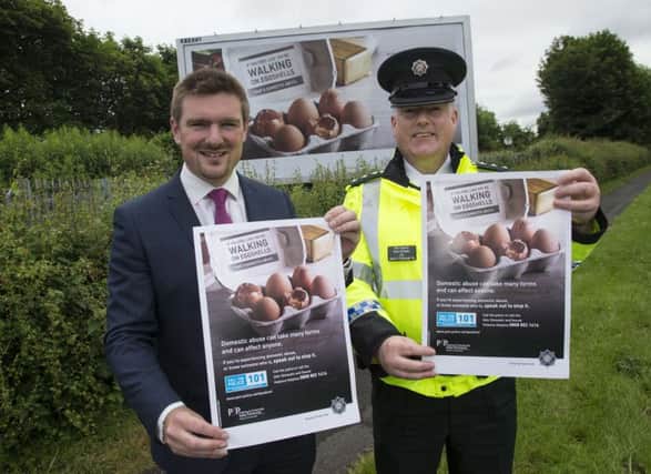 Councillor Scott Carson, Lisburn & Castlereagh PCSP Chairman and Chief Inspector Derek McCamley promote the upcoming domestic violence campaign.