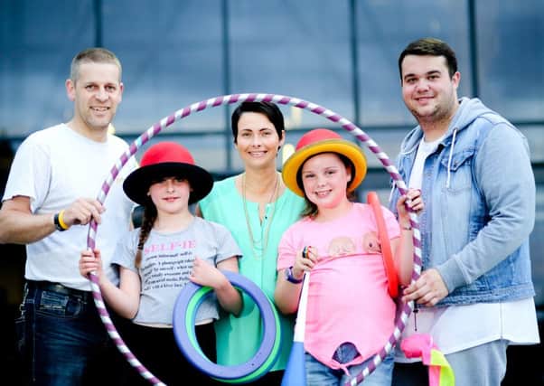 Stephen Bartley (Antrim and Newtownabbey Borough Council) and Debbie Taylor (Antrim and Newtownabbey Borough Council), join Ryan Keery and local children to spread the word about this years BEAT programme. INNT 26-803CON