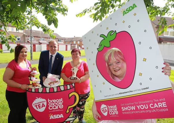 Asda Portadown Community Champion Elaine Livingstone at the Strawberry Tea fundraiser for Breast Cancer Care at the Edgarstown Community Base in Portadown with (from L to R) Asda Cookstown Community Champion Kerrie Murray; Armagh City, Banbridge & Craigavon Borough Councillor Darryn Causby and Chairperson of Edgarstown Residents Association, Phyllis Abraham.