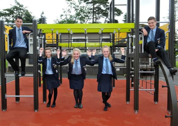 Year 10 students from Cookstown High School try out the new  play area at Coostown Primary School which was officially opened last Friday morning.INMM2616-331