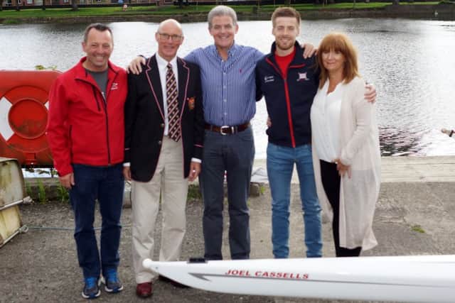 Joel pictured with his parents Charlie and Anna, Seamus Reynolds (coach) and Keith Leighton (Captain).