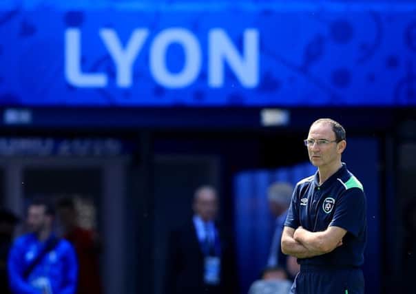 Republic of Ireland Manager Martin O'Neill
 watches his team training